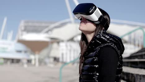 Smiling-woman-in-VR-headset-on-street